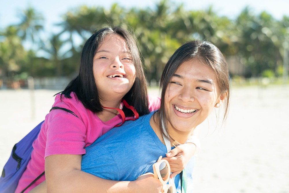 A child and volunteer joyful at International Family Retreat