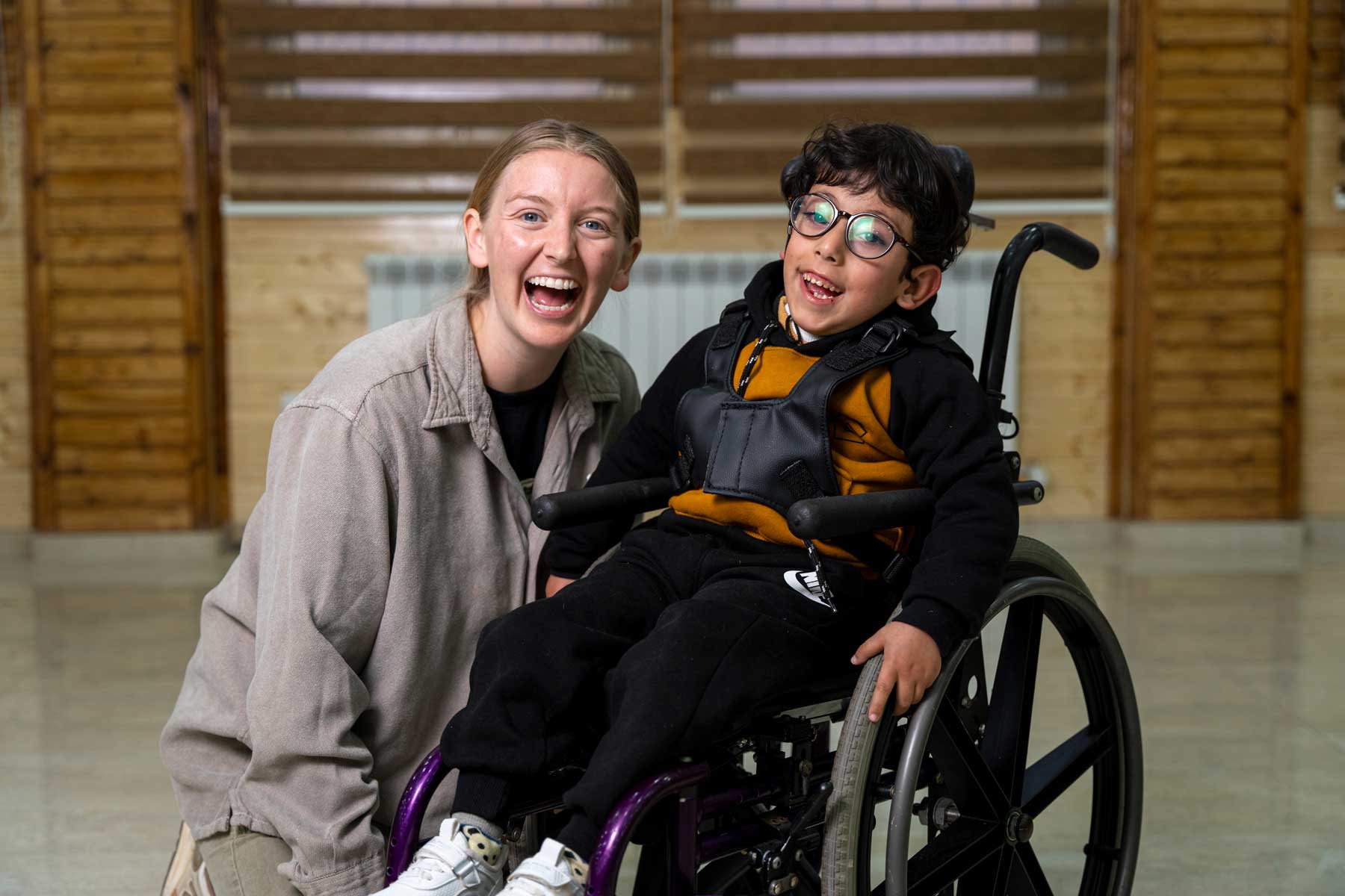 23_WFTW_West_Bank_0658 A volunteer and child in their new wheelchair