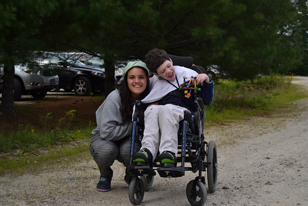 A volunteer and camper at Family Retreat