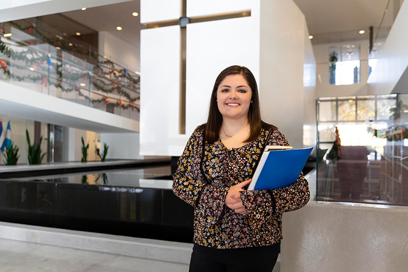 An intern poses for a photo at the International Disability Center