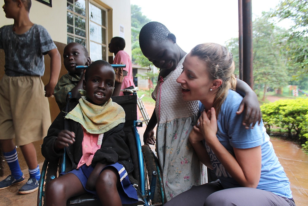 An intern talking to local children