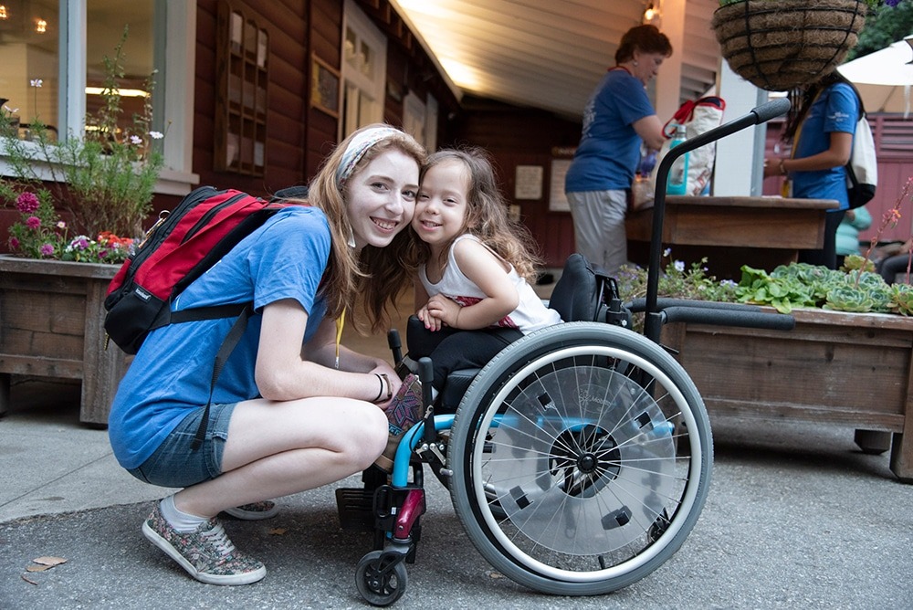 A volunteer and camper at Family Retreat