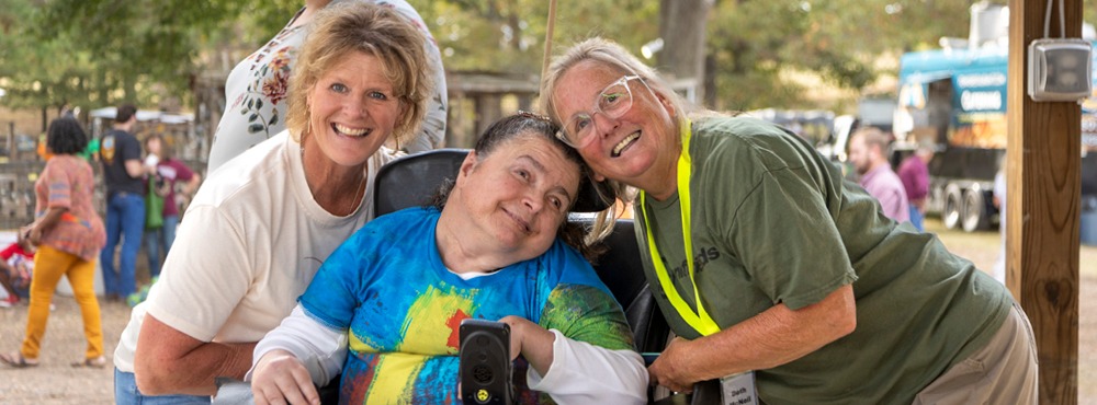 A group poses for a photo at a Joni and Friends event