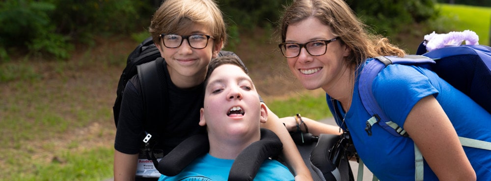 Campers and a volunteer post at Family Retreat