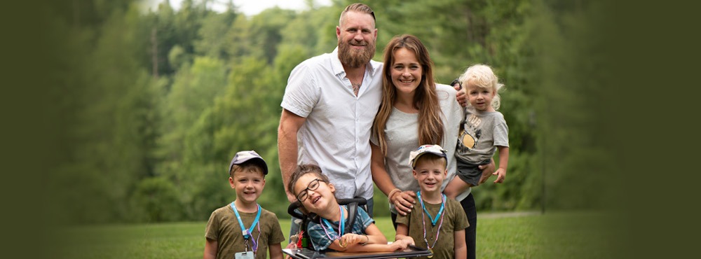 A family poses for a photo at Family Retreat
